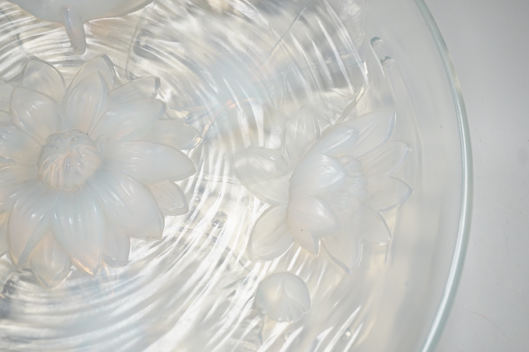 A Verlys opalescent glass dish with flower decoration. 35cm diameter